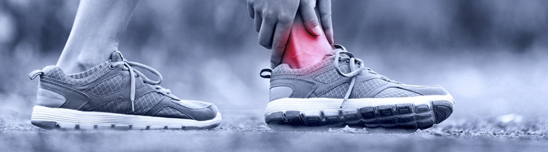 Blog-Ankle-Pain-Stairs person in running shoes with ankle pain
