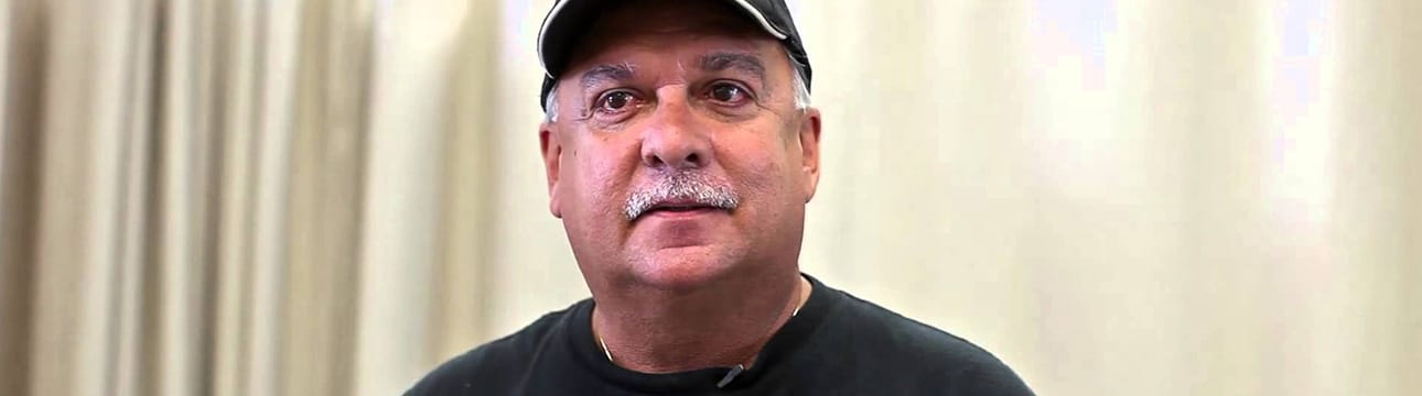 back-injury-physical-therapy-featured-img man in a ball cap