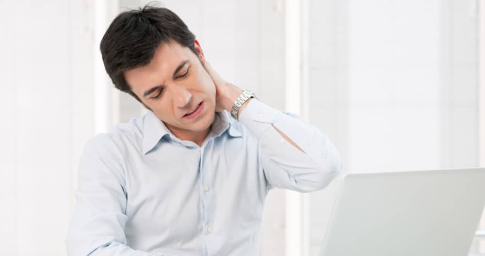 headaches-neck-pain man suffering from neck pain