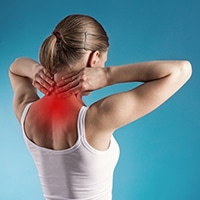 new-services-neck-pain Woman holding neck indicating neck pain