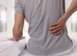 man experiencing chronic back pain in schertz