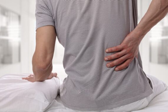 man experiencing chronic back pain in schertz
